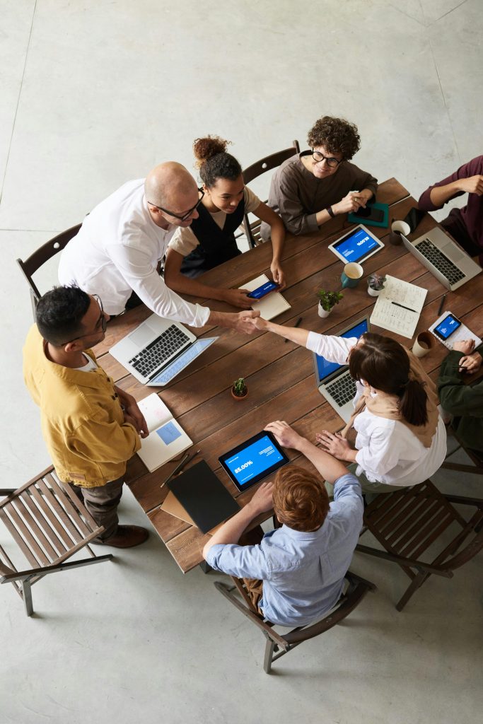 pexels-photo-3183172-3183172 Overhead shot of a diverse team collaborating in a modern office meeting.